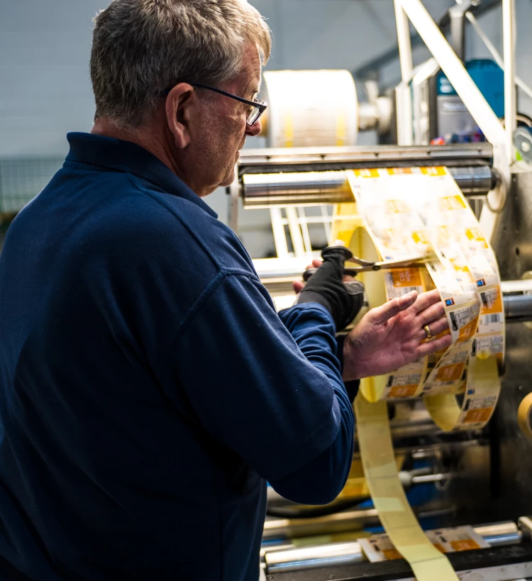 Person cutting labels