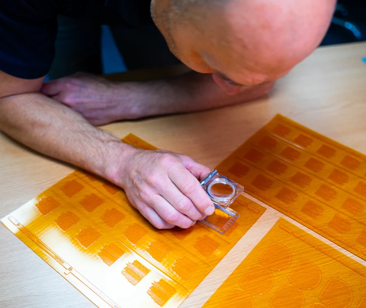 person checking print plates