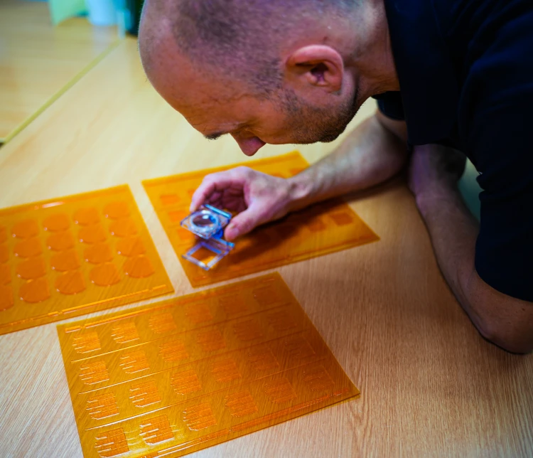 person checking print plates